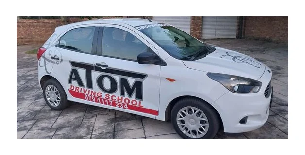 Atom Driving School logo